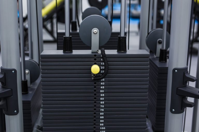 black iron heavy plates stacked of weight machine PZT8TKT 4 768x512