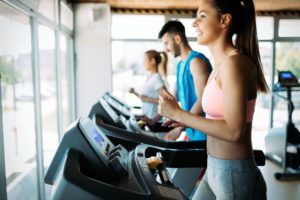 healthy man and woman running on a treadmill in a P5QDB9S 2 300x200