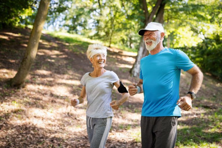 mature couple jogging and running outdoors in YQC9FRB 768x512