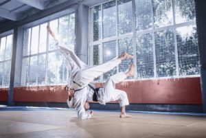 two judo fighters showing technical skill while A4L2RH7 1 300x201