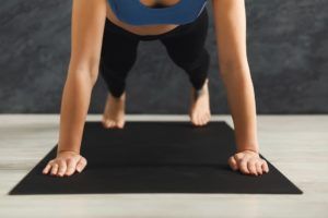 unrecognizable woman training yoga in plank pose P9TQ7HM 10 300x200