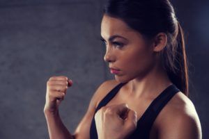 woman holding fists and fighting in gym PR6KQU8 3 300x200