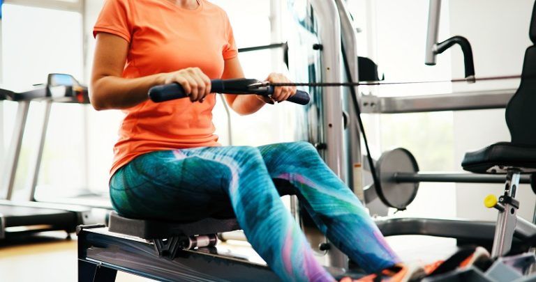 woman pulling on row machine in fitness 2AAASYA 768x405