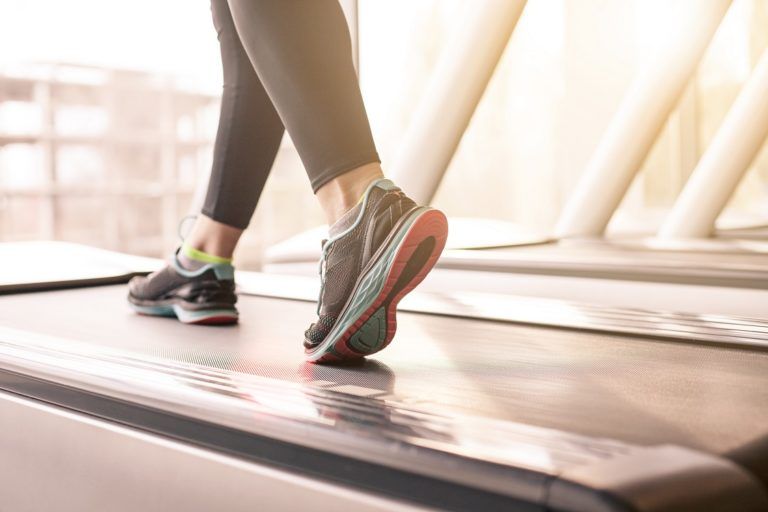 woman running in a gym on a treadmill concept for P4J7KM3 768x512