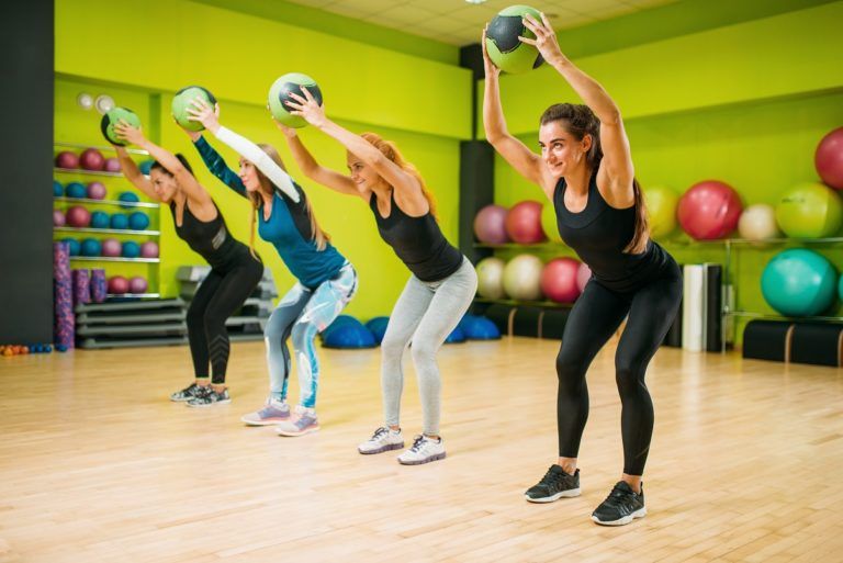 women group with balls fitness workout PH52BJG 768x513