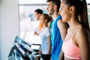 healthy man and woman running on a treadmill in a EQ72KNH 300x200